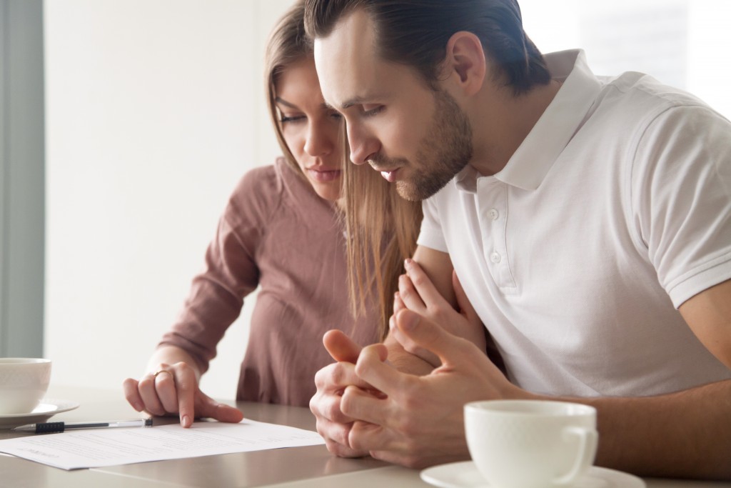 Couple reading through the contract