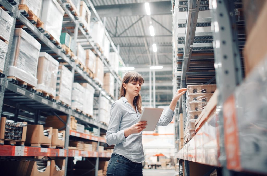 woman checking warehouse inventory