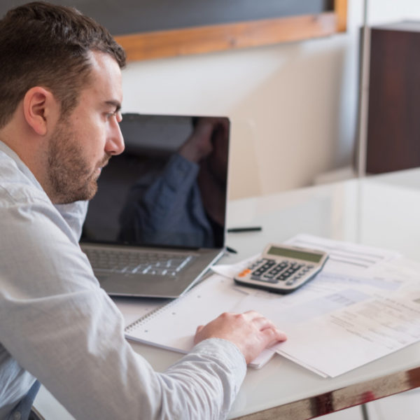 man looking at documents