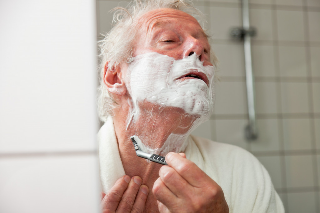 A senior citizen using the bathroom