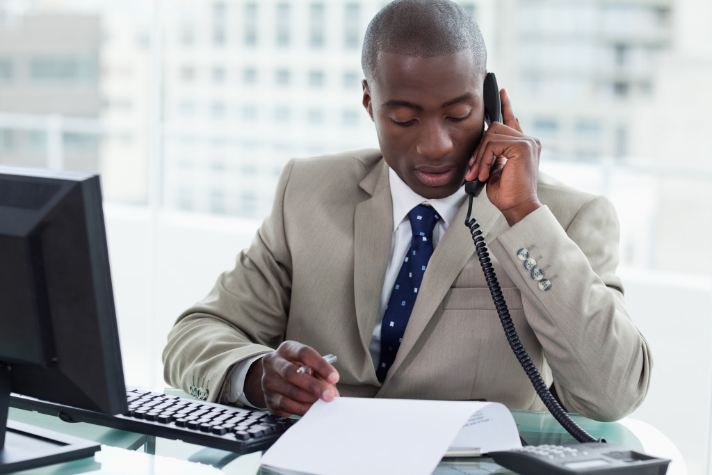 a man talking to a potential client over the phone