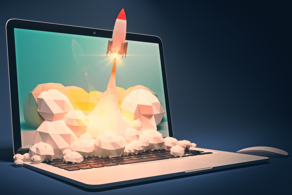 rocket launching off a laptop