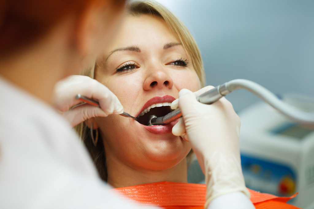 a young woman in a dental cleaning session