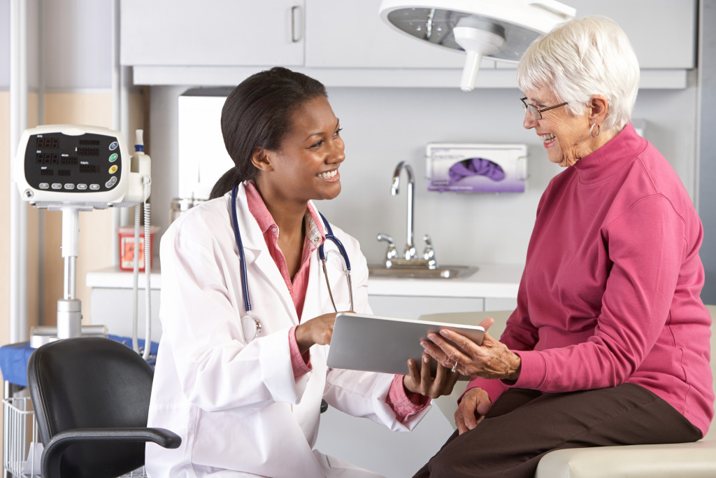 An old woman checking with her doctor