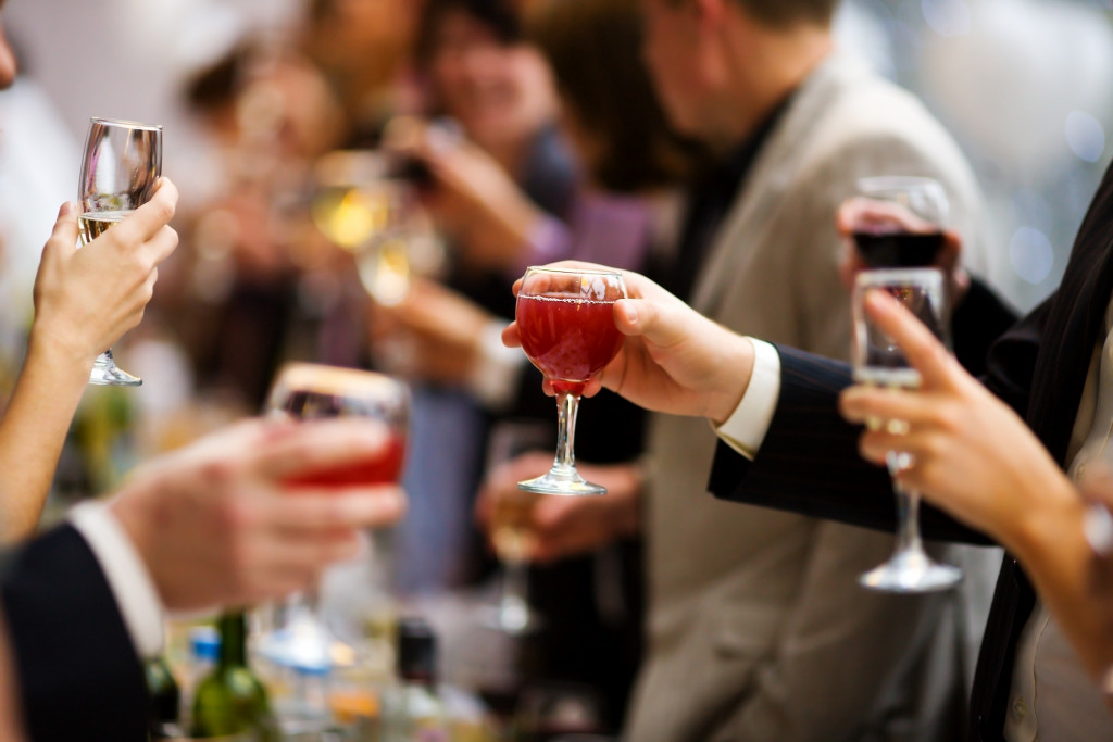 People cheering with wine and champagne during an event