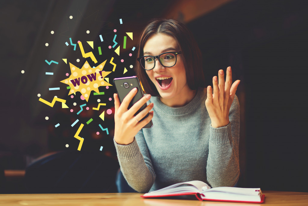 A girl excited about a notification she received