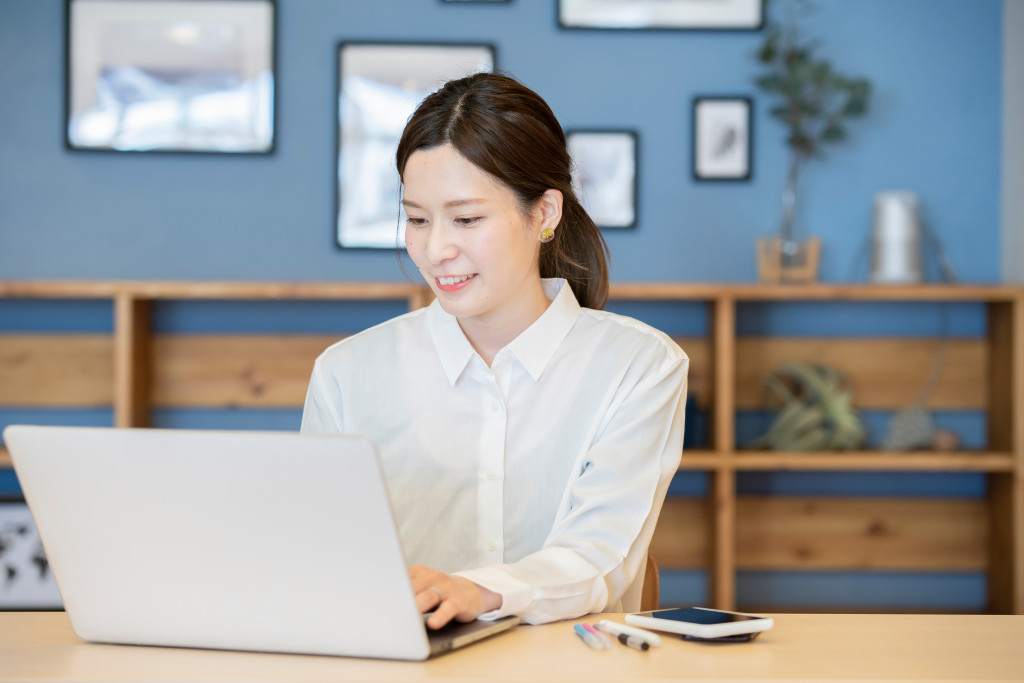 A woman working from home with her laptop