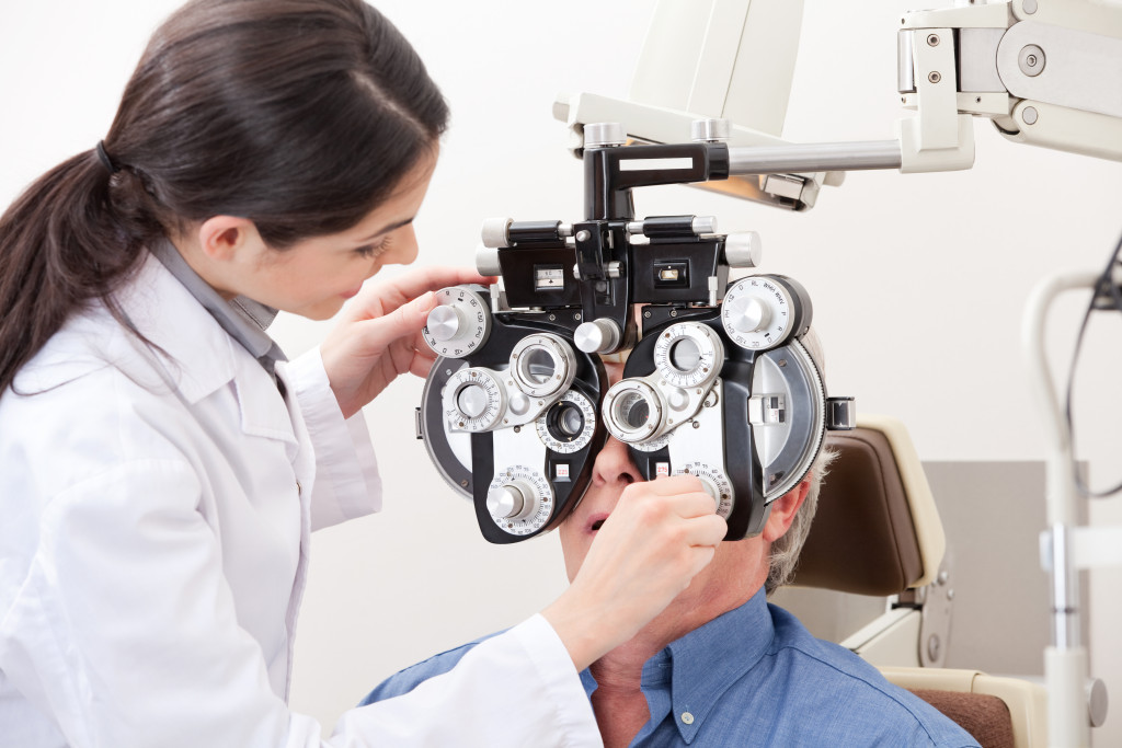 a man getting a vision test in a doctor's clinic