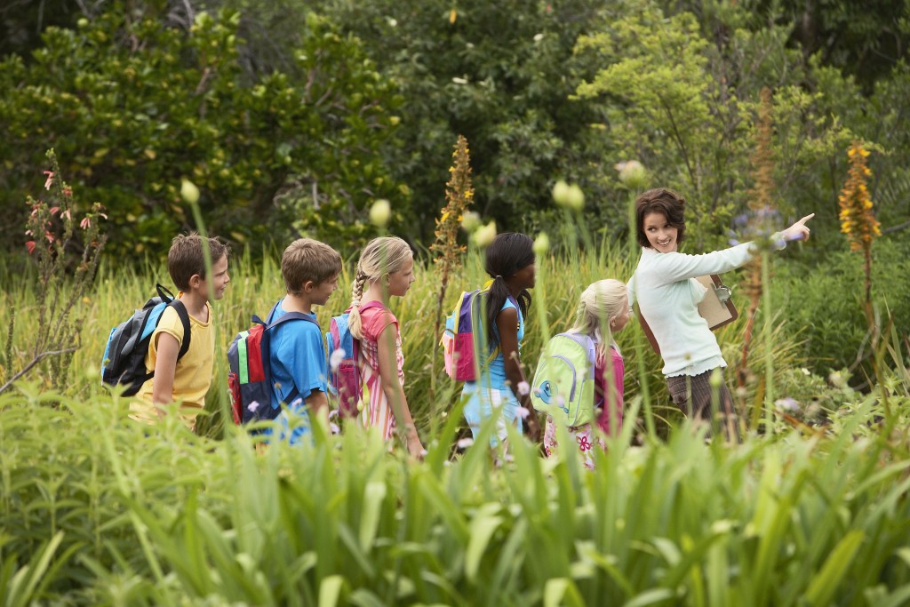 A group of students and a teacher on a field trip