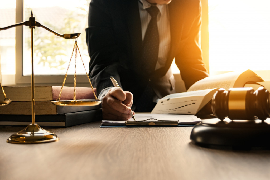 lawyer signing a document in office