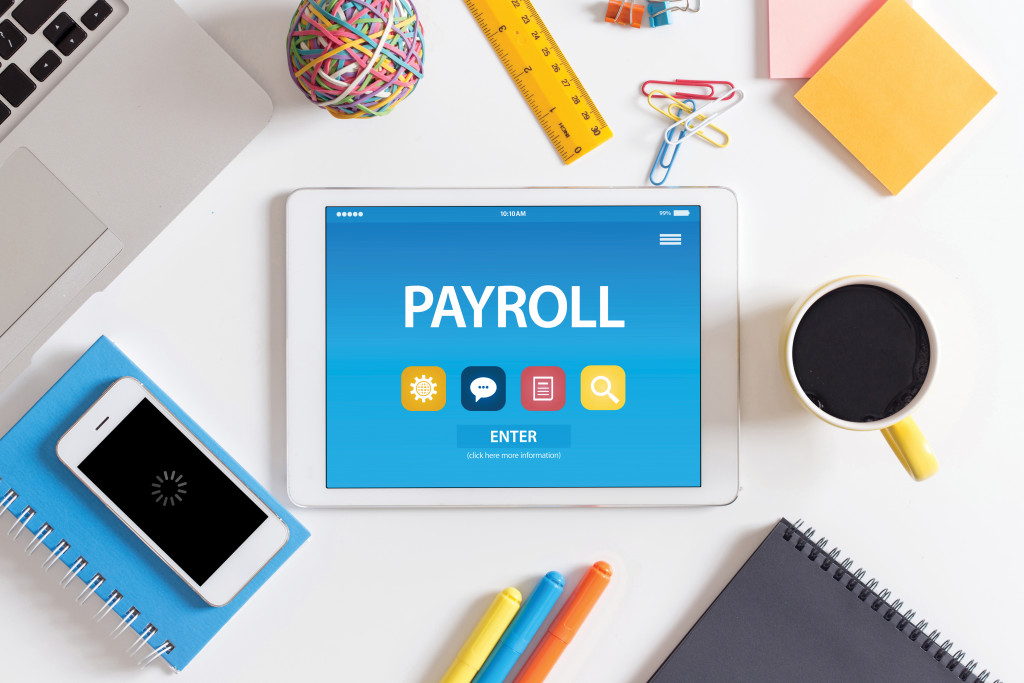 payroll app in the tablet of a businessman 